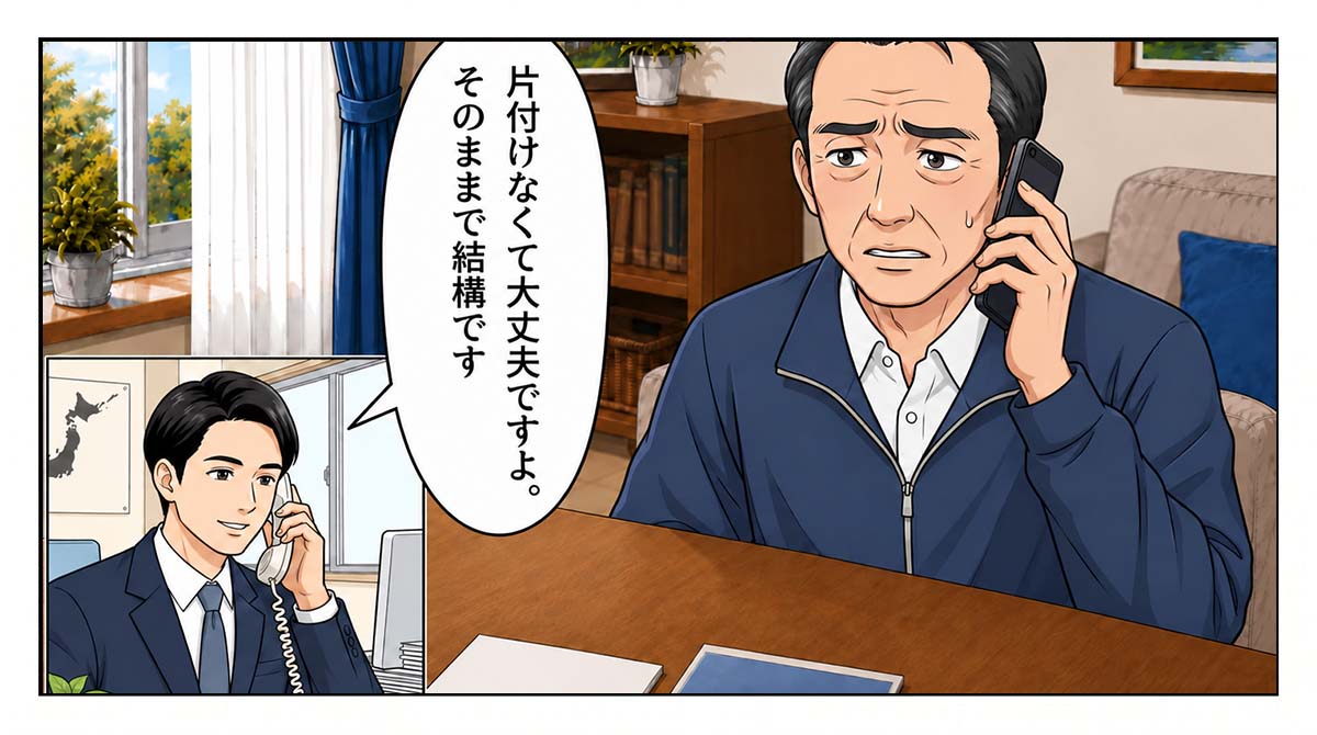 オフィスで受話器を持ち微笑む担当者。「片付けなくて大丈夫ですよ。そのままで結構です」